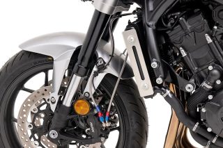 オートバイのフロント部分、ブレーキ、タイヤのクローズアップ