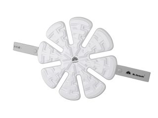 白いを基調とした、花のような形状のコースターまたはマットです。表面には迷路のようなパターンがあり、「Mr. Nomads」のブランドロゴと「お名前：」と書かれた部分があります。
